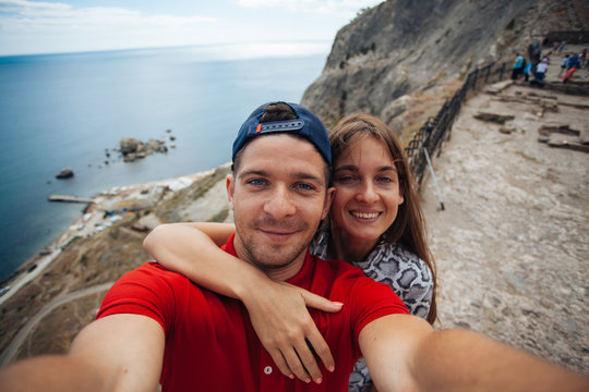 Beautiful couple making selfie in instagram in Sudak, Russia