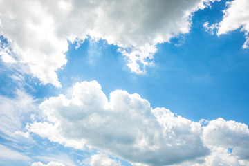 Obraz premium White fluffy clouds in the blue sky