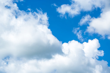 White fluffy clouds in the blue sky