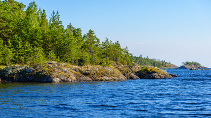 The shores of the straits often have a rounded shape. Ladoga lake skerries, Pitkyaranta, Karelia,...