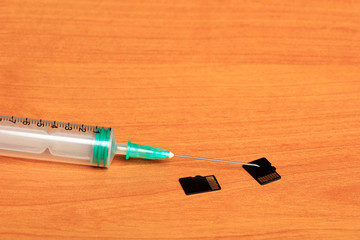 Creative Set of Medical Syringe on Wood Background