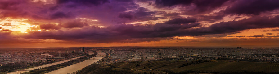 Ultra wide panoramic view of Vienna (Austria) looking southeast from Leopoldsberg at sunrise