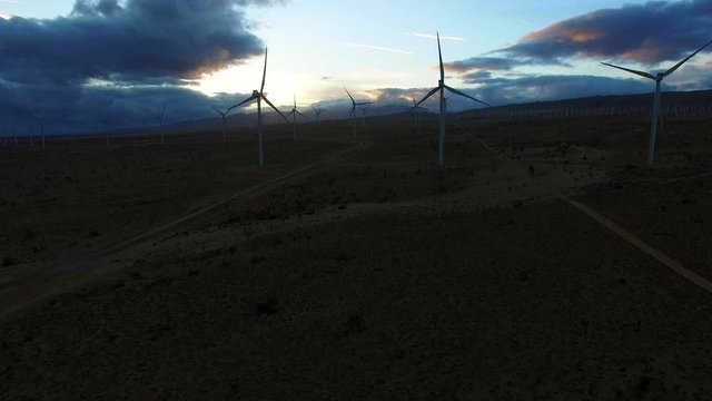 Magnificent aerial view of wind electricity generators at dawn