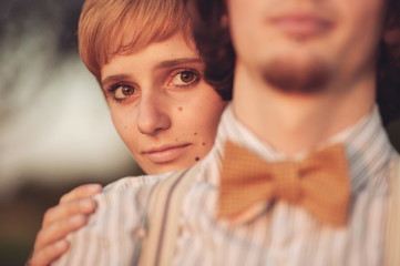 Young wedding couple enjoying romantic moments outside on a summ