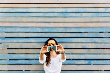 Self portrait of beautiful young woman with mobile. Selfie Concept.
