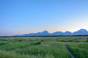 Rocky Mountains of Grand Teton on a sunset background in the Wyoming state, USA