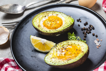 Homemade Organic Egg Baked in Avocado with Salt and Pepper