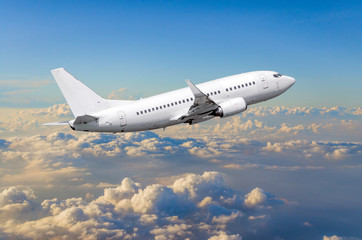 Fototapeta na wymiar Airplane in the sky above the clouds flight journey sun height