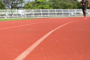 Young runners are jogging on the treadmill.