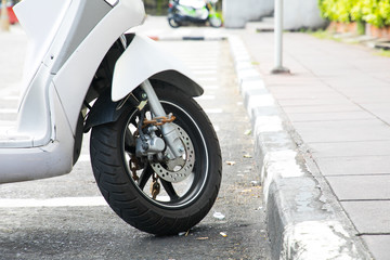 Security lock blocking the motorcycle wheel