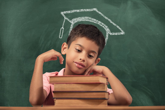 School Child on Blackboard Background 