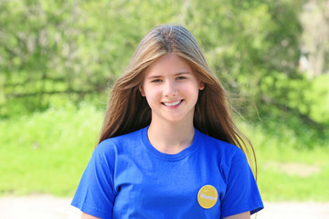 Young beautiful girl standing outdoors. Volunteering concept