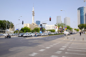 Fototapeta na wymiar City road with cars and motorcyclist