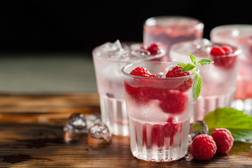 Red refreshing cocktail with raspberry and mint
