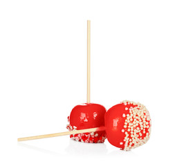 Delicious candy apples on white background