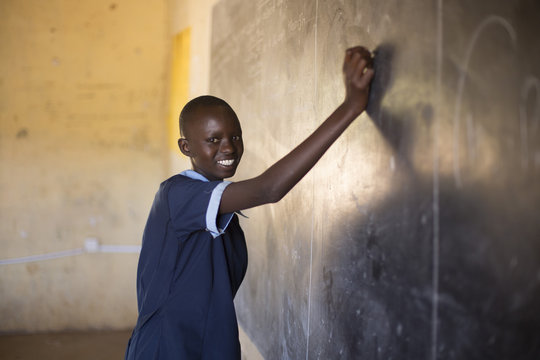 School girl in classroom. Kenya, Africa.