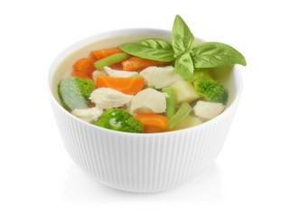 Bowl with delicious turkey soup on white background