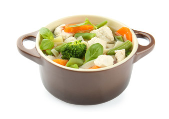 Tureen with delicious turkey soup on white background