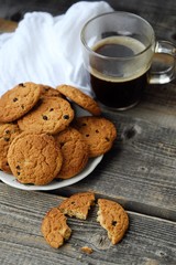 Homemade oatmeal cookies with raisins and coffee 