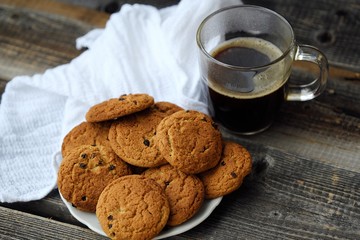 Homemade oatmeal cookies with raisins and coffee 