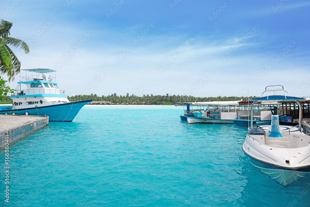 Sticker modern boats berthed at tropical resort