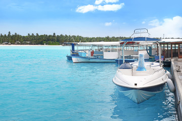 Fototapeta na wymiar Modern boats berthed at tropical resort
