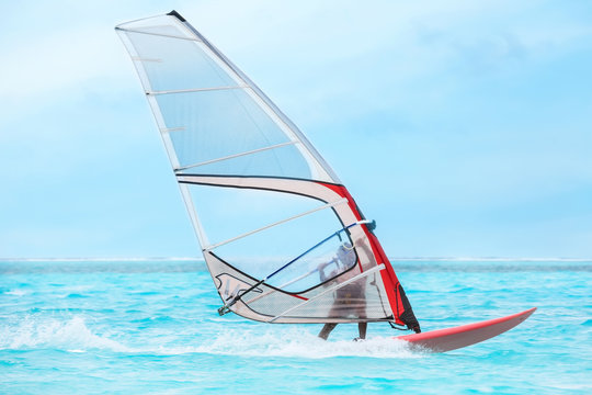Tourist windsurfing at sea resort