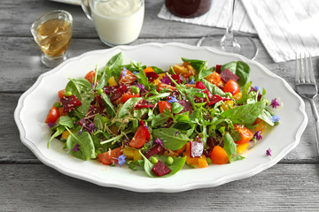 Plate with useful beet salad on table