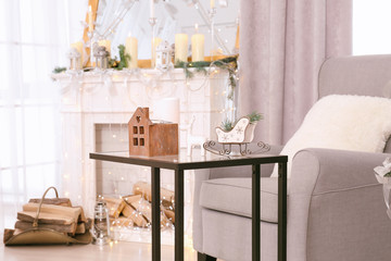 Table with Christmas decorations in beautiful living room