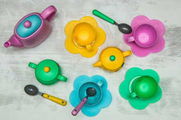 Kids tea coffee serving set, colorful cups, saucers, spoons, teapot, sugar bowl, creamer