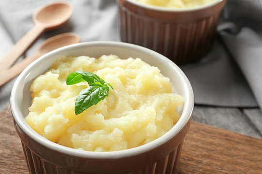Ramekin with mashed potatoes on table, closeup
