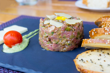 tasty Steak tartare (Raw beef) - classic steak tartare on white plate