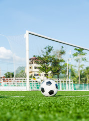 Soccer Football on the green grass of Soccer field.