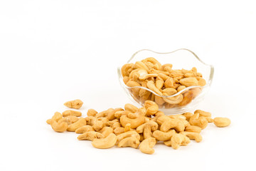 cashew nuts in glass bowl on white background.