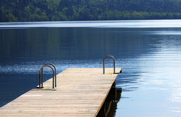 Dock with mountains and calm water