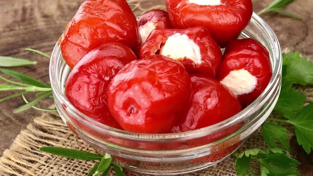 Fresh made Red Peppers (filled) (rotating) as seamless loopable 4K UHD footage)