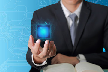 Double exposure of businessman hand hold blue Central Processing Unit (CPU) circuit hi-tech as business, control, technology and future concept.