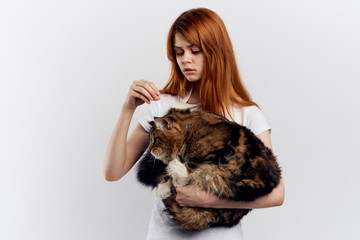 Beautiful woman holding a cat