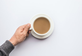 Male hand holding cup of coffee.business and drink concept