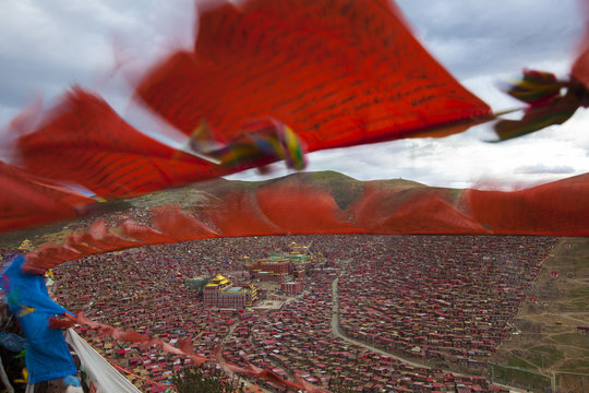 Tibetan prayer Flags flying in front of The Larung Gar Buddhist