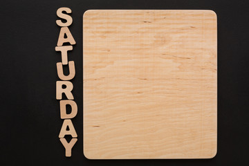 Word Saturday with blank wooden board