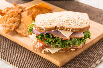 Turkey Ham and Swiss Cheese Sandwich With Chips