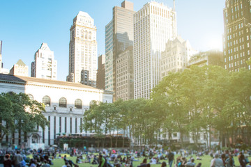 Crowds of people gather on the grass at Bryant Park for a summer festival in Midtown Manhattan on a...