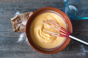 top view mixing ingredients for vanilla pudding