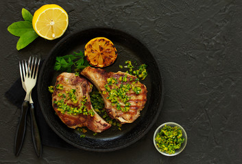 Pork cutlet on a bone with gremolat sauce.