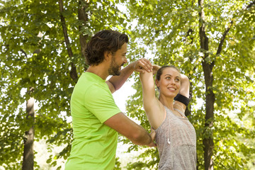 Fototapeta premium Young couple having exercise in the park