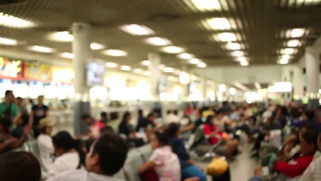 Blurred of Asia People sitting and waiting for bus car at terminal transportation at Mo Chit station transport in Thailand. 