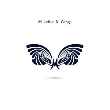 M-letter sign and angel wings.Monogram wing vector logo template.Classic emblem.