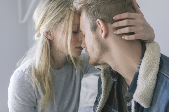 Girl Shares Tender Moment with Boy