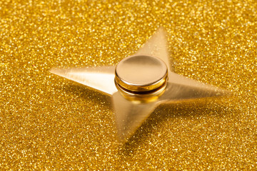 Golden spinner on a sparkling background